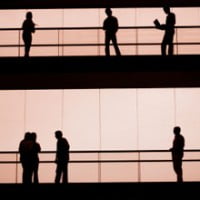 photo of people in workplace talking on different floors for article about human capital by john sumser on hr examiner february 13, 2014