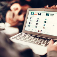 photo of website in coffee shop in HRExaminer.com article about new website from Staffing Advisors