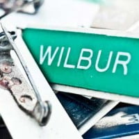 photo in HR Examiner feature article showing name badge v5.41 December 12, 2014