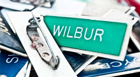 photo in HR Examiner feature article showing name badge v5.41 December 12, 2014