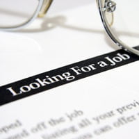 photo of resume with text 'looking for a job' and glasses in background on hrexaminer.com article April 2, 2015 by John Sumser