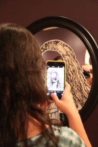 photo of woman taking selfie in mirror on HRExaminer.com article by Heather Bussing April 20, 2015