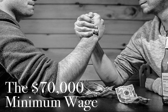 photo of people arm wrestling over money in HRExaminer.com article by Paul Hebert on GravityPayments pay issue