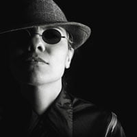 photo of woman in hat scowling through dark sunglasses on HRExaminer.com feature image September 4, 2015