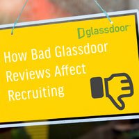 small square crop image of glass window with yellow sign in HRExaminer.com article published September 18, 2015 titled How Bad Glassdoor Review Affect Recruiting