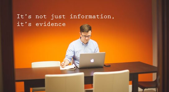 photo of man at desk in HRExaminer.com article by Heather Bussing titled It's not just information, it's evidence