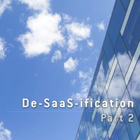 photo of office building with white clouds over blue sky in HRExaminer article, De-Saas-ification, part 2, small feature image