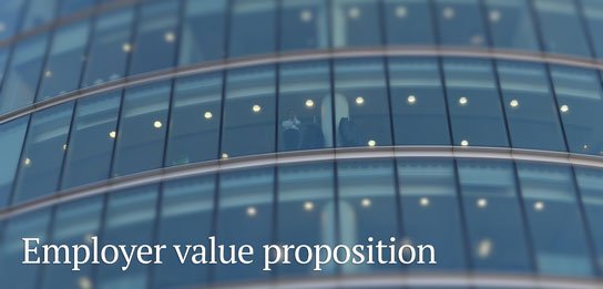 photo of office tower with man standing in window in HRExaminer.com feature article in Weekly Edition v7.13 for April 1, 2016