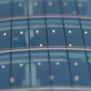 photo of man in window of office tower building cc0 photo credit Chris Davis in HRExaminer.com article by John Sumser titled Rethinking EVP and Employer Brand Like You Never Have Before March 30, 2016