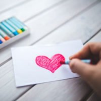 photo of person drawing heart with oil pastels in HRExaminer.com article by Maren Hogan